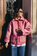 Veste en laine rose et rouge